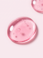 Sérum PDRN Pink Monodosis KOEC — macro de la gota de serum rosa