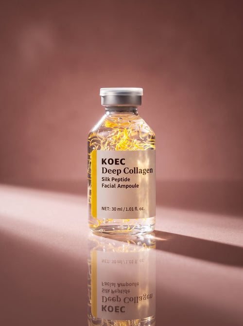 Ampolla KOEC Deep Collagen — detalle del frasco con hebras de seda doradas