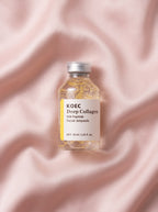 Ampolla KOEC Deep Collagen sobre seda rosa — péptidos de seda