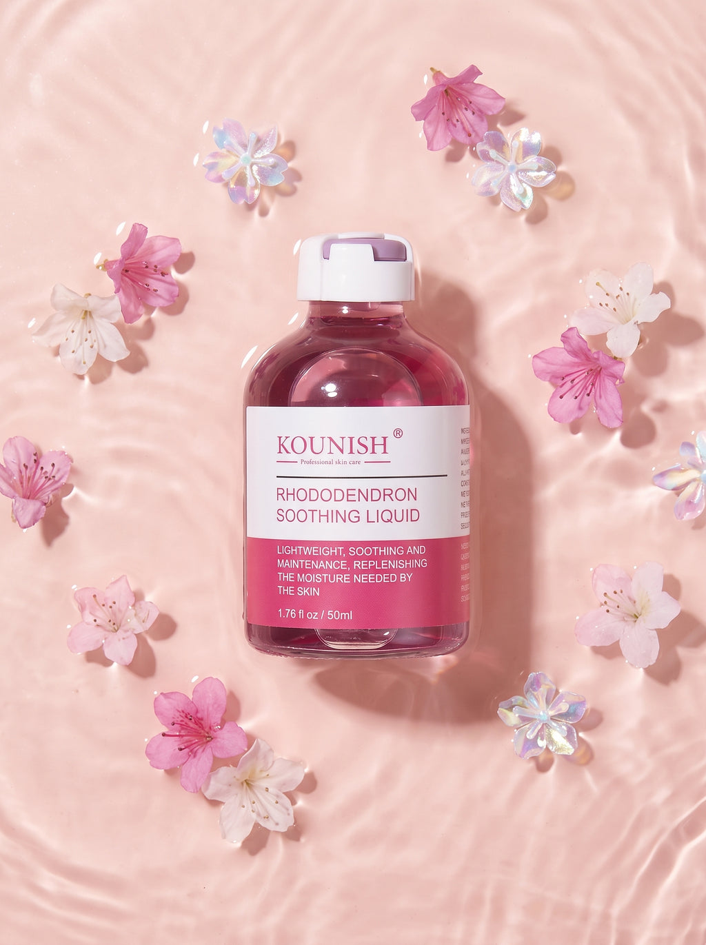 KOUNISH Rhododendron Soothing Liquid — flatlay con flores