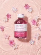 KOUNISH Rhododendron Soothing Liquid — flatlay con flores
